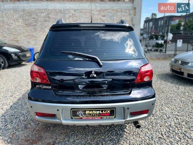 Черный Мицубиси Аутлендер, объемом двигателя 2.4 л и пробегом 270 тыс. км за 5999 $, фото 5 на Automoto.ua