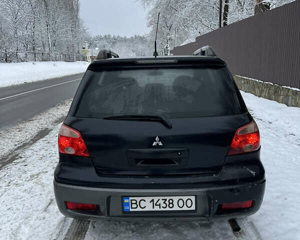 Чорний Міцубісі Аутлендер, об'ємом двигуна 2.4 л та пробігом 308 тис. км за 4700 $, фото 4 на Automoto.ua