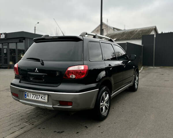 Чорний Міцубісі Аутлендер, об'ємом двигуна 2 л та пробігом 297 тис. км за 6200 $, фото 7 на Automoto.ua
