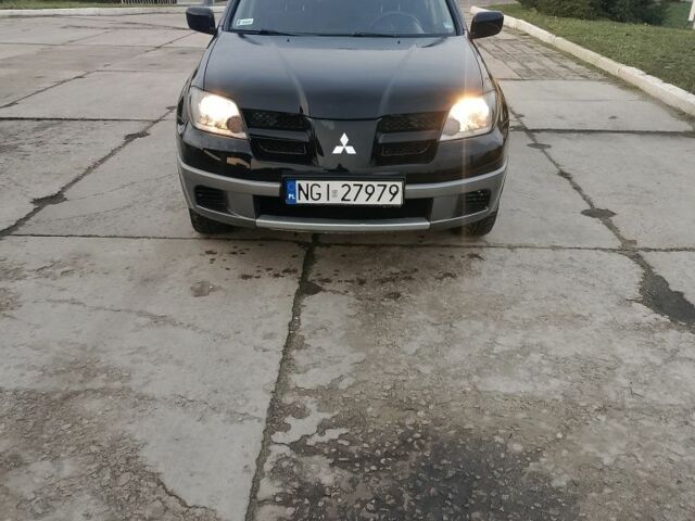 Черный Мицубиси Аутлендер, объемом двигателя 2 л и пробегом 169 тыс. км за 3500 $, фото 6 на Automoto.ua