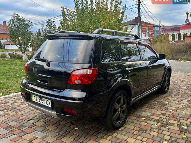 Чорний Міцубісі Аутлендер, об'ємом двигуна 2.38 л та пробігом 247 тис. км за 5499 $, фото 25 на Automoto.ua