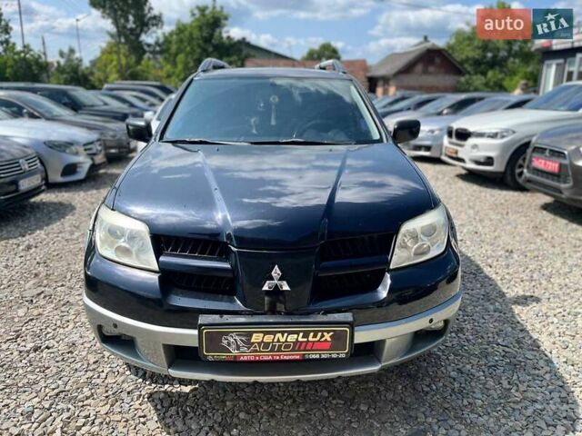 Черный Мицубиси Аутлендер, объемом двигателя 2.4 л и пробегом 270 тыс. км за 5999 $, фото 1 на Automoto.ua