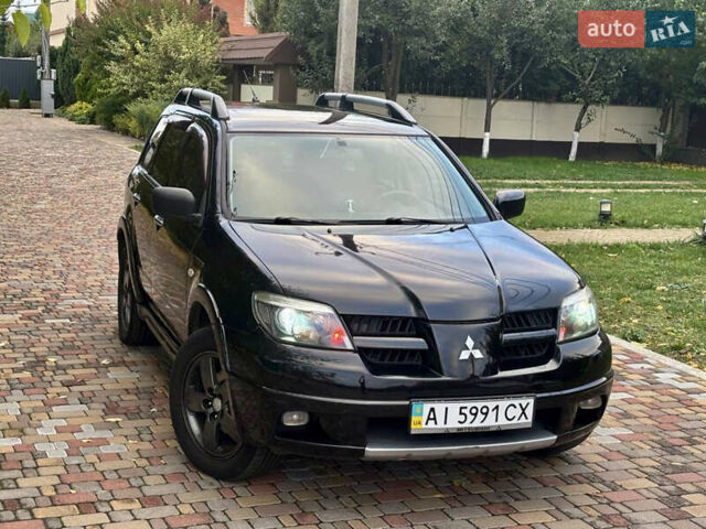Чорний Міцубісі Аутлендер, об'ємом двигуна 2.38 л та пробігом 247 тис. км за 5499 $, фото 35 на Automoto.ua