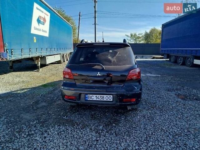 Чорний Міцубісі Аутлендер, об'ємом двигуна 2.38 л та пробігом 307 тис. км за 4600 $, фото 9 на Automoto.ua