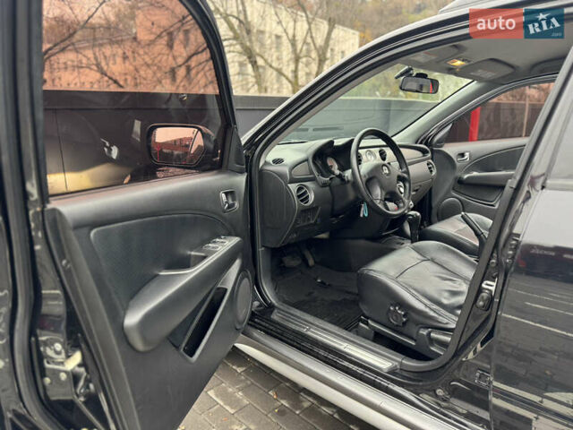 Черный Мицубиси Аутлендер, объемом двигателя 2.4 л и пробегом 242 тыс. км за 6800 $, фото 25 на Automoto.ua