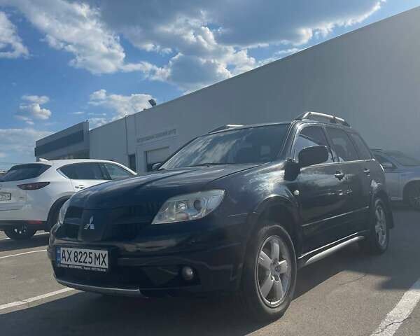 Черный Мицубиси Аутлендер, объемом двигателя 2.38 л и пробегом 260 тыс. км за 5000 $, фото 4 на Automoto.ua