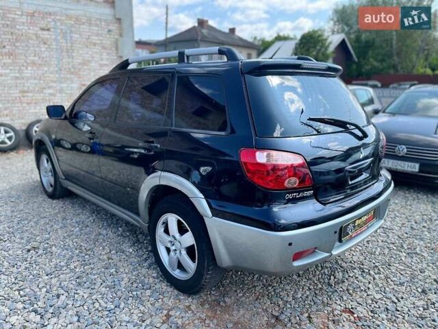 Черный Мицубиси Аутлендер, объемом двигателя 2.4 л и пробегом 270 тыс. км за 5999 $, фото 4 на Automoto.ua