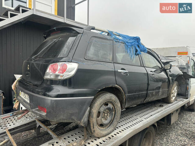 Черный Мицубиси Аутлендер, объемом двигателя 2.4 л и пробегом 240 тыс. км за 2200 $, фото 15 на Automoto.ua