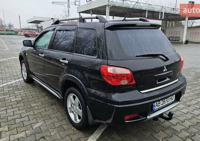 Черный Мицубиси Аутлендер, объемом двигателя 2.4 л и пробегом 167 тыс. км за 6150 $, фото 10 на Automoto.ua