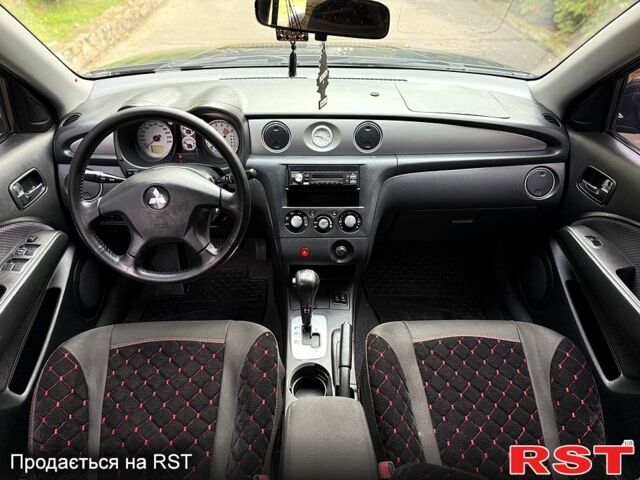 Черный Мицубиси Аутлендер, объемом двигателя 2.4 л и пробегом 263 тыс. км за 5999 $, фото 6 на Automoto.ua