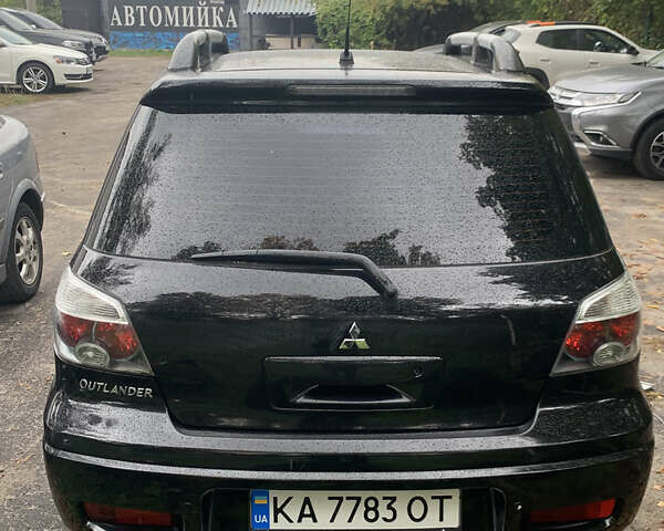 Черный Мицубиси Аутлендер, объемом двигателя 2.4 л и пробегом 200 тыс. км за 7000 $, фото 12 на Automoto.ua