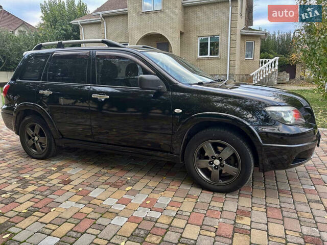 Чорний Міцубісі Аутлендер, об'ємом двигуна 2.38 л та пробігом 247 тис. км за 5499 $, фото 31 на Automoto.ua
