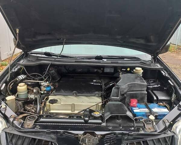 Черный Мицубиси Аутлендер, объемом двигателя 2.4 л и пробегом 256 тыс. км за 6900 $, фото 13 на Automoto.ua