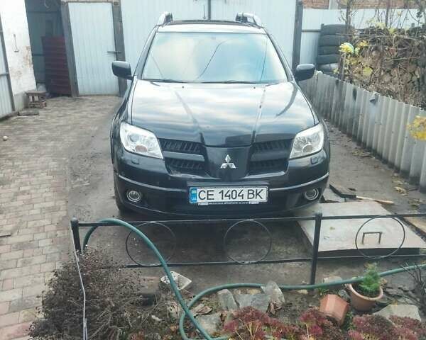 Черный Мицубиси Аутлендер, объемом двигателя 2.4 л и пробегом 280 тыс. км за 5455 $, фото 13 на Automoto.ua