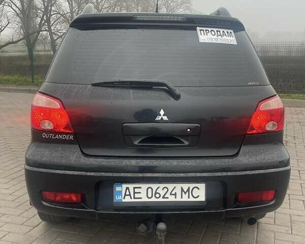 Черный Мицубиси Аутлендер, объемом двигателя 2.4 л и пробегом 277 тыс. км за 6700 $, фото 4 на Automoto.ua