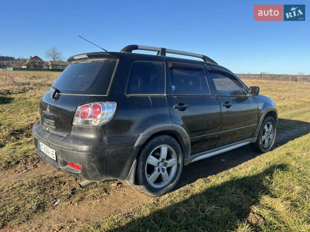 Черный Мицубиси Аутлендер, объемом двигателя 2.38 л и пробегом 230 тыс. км за 5350 $, фото 3 на Automoto.ua