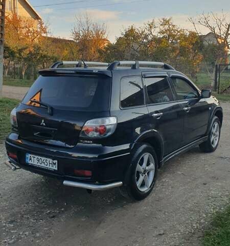 Міцубісі Аутлендер 2006 у Івано-Франківську на Automoto.ua Чорний Міцубісі Аутлендер, об'ємом двигуна 2 л та пробігом 263 тис. км за 7250 $, фото 14 на Automoto.ua