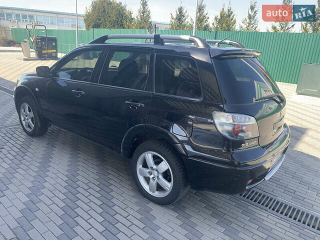 Черный Мицубиси Аутлендер, объемом двигателя 2 л и пробегом 212 тыс. км за 6000 $, фото 6 на Automoto.ua