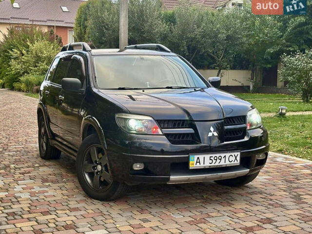 Чорний Міцубісі Аутлендер, об'ємом двигуна 2.38 л та пробігом 247 тис. км за 5499 $, фото 39 на Automoto.ua