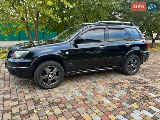 Чорний Міцубісі Аутлендер, об'ємом двигуна 2.38 л та пробігом 247 тис. км за 5499 $, фото 8 на Automoto.ua