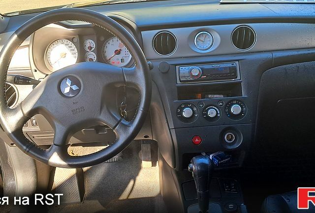 Черный Мицубиси Аутлендер, объемом двигателя 2.4 л и пробегом 185 тыс. км за 7500 $, фото 3 на Automoto.ua