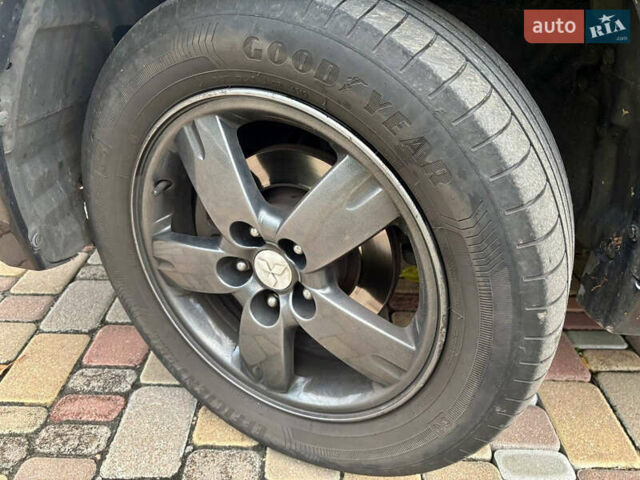 Чорний Міцубісі Аутлендер, об'ємом двигуна 2.38 л та пробігом 247 тис. км за 5499 $, фото 9 на Automoto.ua