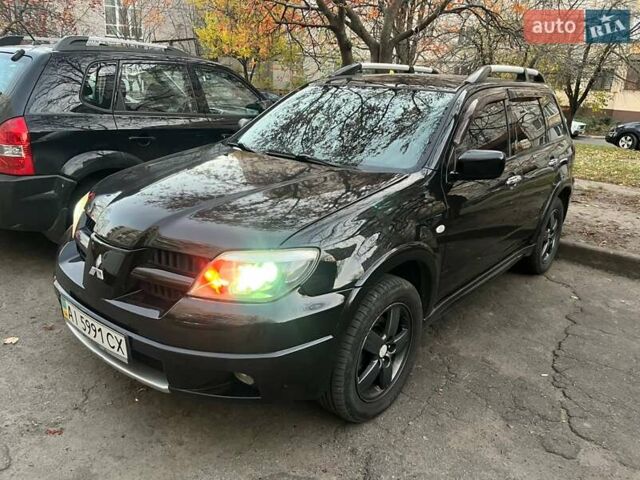 Чорний Міцубісі Аутлендер, об'ємом двигуна 2.38 л та пробігом 247 тис. км за 5499 $, фото 43 на Automoto.ua