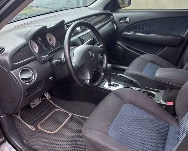 Черный Мицубиси Аутлендер, объемом двигателя 2.4 л и пробегом 256 тыс. км за 6900 $, фото 10 на Automoto.ua