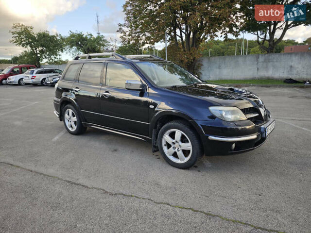 Чорний Міцубісі Аутлендер, об'ємом двигуна 2 л та пробігом 207 тис. км за 6900 $, фото 1 на Automoto.ua