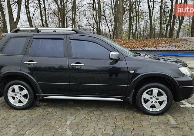 Черный Мицубиси Аутлендер, объемом двигателя 2.4 л и пробегом 167 тыс. км за 6150 $, фото 7 на Automoto.ua
