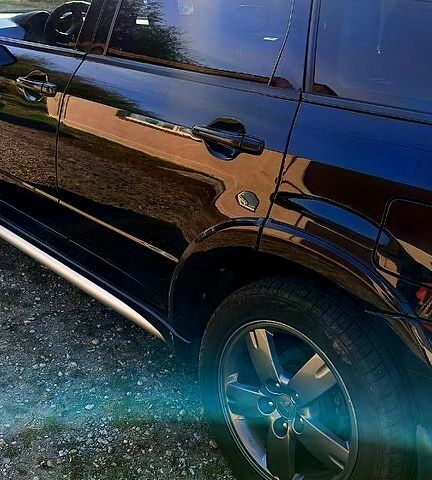 Черный Мицубиси Аутлендер, объемом двигателя 2.4 л и пробегом 265 тыс. км за 7500 $, фото 3 на Automoto.ua