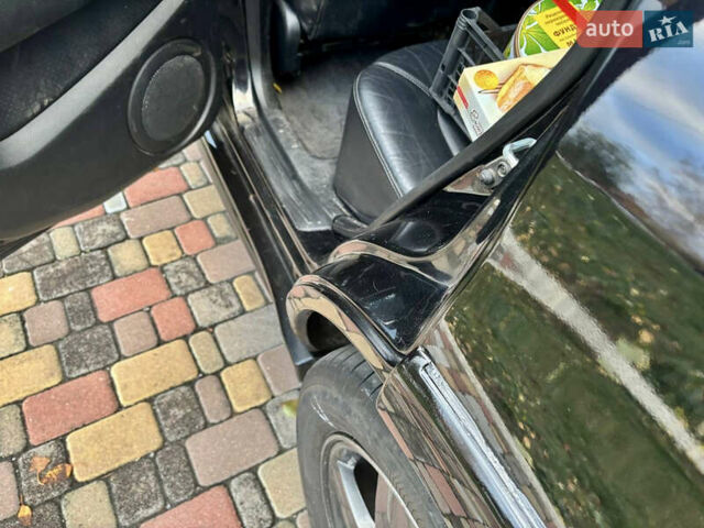 Чорний Міцубісі Аутлендер, об'ємом двигуна 2.38 л та пробігом 247 тис. км за 5499 $, фото 13 на Automoto.ua