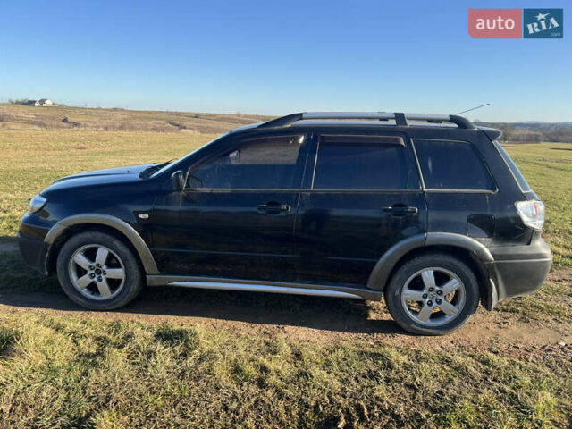 Черный Мицубиси Аутлендер, объемом двигателя 2.38 л и пробегом 230 тыс. км за 5350 $, фото 6 на Automoto.ua
