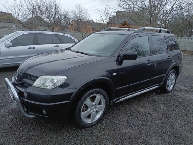 Черный Мицубиси Аутлендер, объемом двигателя 2 л и пробегом 200 тыс. км за 5100 $, фото 12 на Automoto.ua