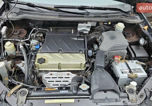 Черный Мицубиси Аутлендер, объемом двигателя 2.4 л и пробегом 167 тыс. км за 6150 $, фото 29 на Automoto.ua