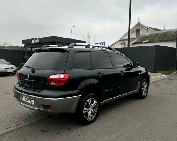 Чорний Міцубісі Аутлендер, об'ємом двигуна 2 л та пробігом 297 тис. км за 6200 $, фото 8 на Automoto.ua