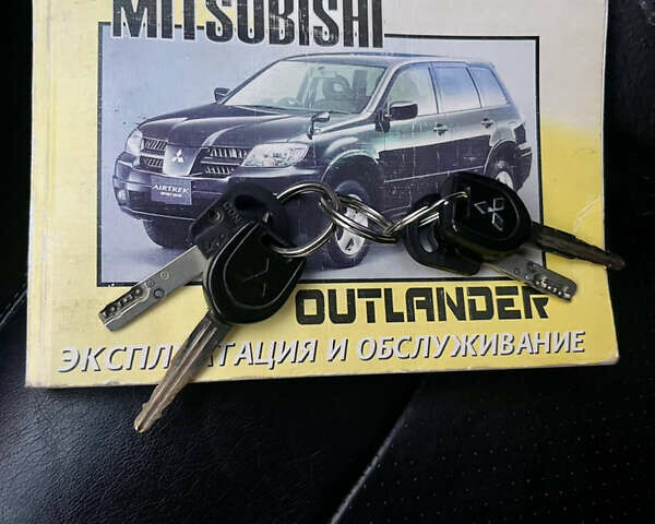 Чорний Міцубісі Аутлендер, об'ємом двигуна 2.38 л та пробігом 247 тис. км за 5499 $, фото 70 на Automoto.ua