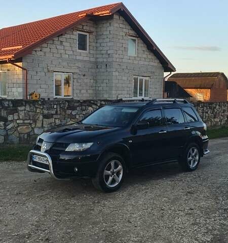 Міцубісі Аутлендер 2006 у Івано-Франківську на Automoto.ua Чорний Міцубісі Аутлендер, об'ємом двигуна 2 л та пробігом 263 тис. км за 7250 $, фото 11 на Automoto.ua