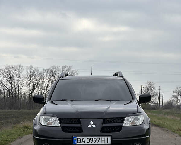 Черный Мицубиси Аутлендер, объемом двигателя 2 л и пробегом 230 тыс. км за 6300 $, фото 11 на Automoto.ua