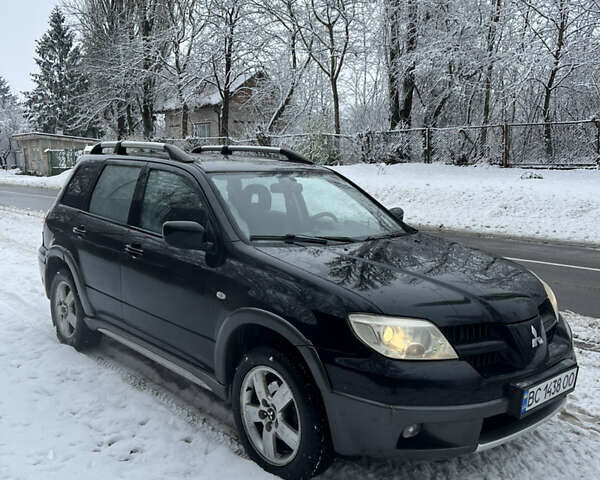 Чорний Міцубісі Аутлендер, об'ємом двигуна 2.4 л та пробігом 308 тис. км за 4700 $, фото 2 на Automoto.ua