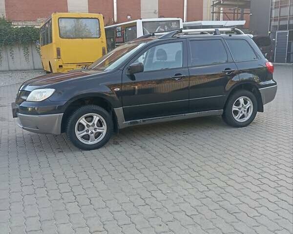 Черный Мицубиси Аутлендер, объемом двигателя 2 л и пробегом 297 тыс. км за 4550 $, фото 5 на Automoto.ua