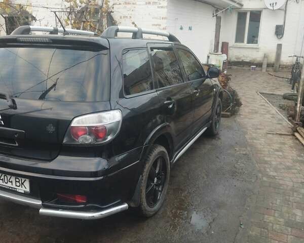 Черный Мицубиси Аутлендер, объемом двигателя 2.4 л и пробегом 280 тыс. км за 5455 $, фото 4 на Automoto.ua
