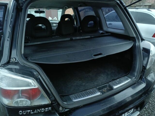 Черный Мицубиси Аутлендер, объемом двигателя 2 л и пробегом 200 тыс. км за 5100 $, фото 19 на Automoto.ua