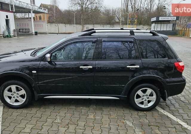 Черный Мицубиси Аутлендер, объемом двигателя 2.4 л и пробегом 167 тыс. км за 6150 $, фото 9 на Automoto.ua