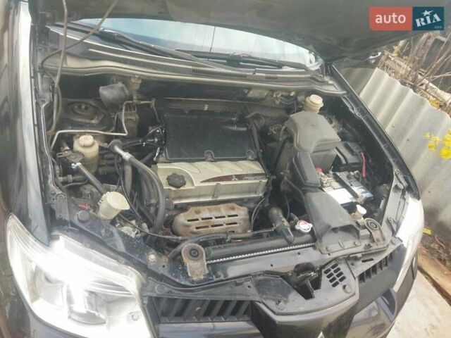 Черный Мицубиси Аутлендер, объемом двигателя 2.4 л и пробегом 280 тыс. км за 5455 $, фото 11 на Automoto.ua