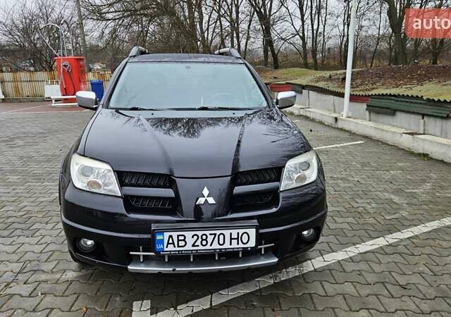 Черный Мицубиси Аутлендер, объемом двигателя 2.4 л и пробегом 167 тыс. км за 6150 $, фото 6 на Automoto.ua