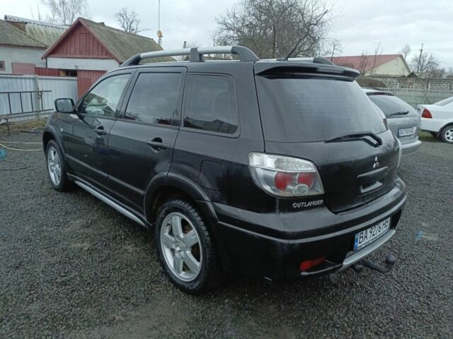 Черный Мицубиси Аутлендер, объемом двигателя 2 л и пробегом 200 тыс. км за 5100 $, фото 14 на Automoto.ua
