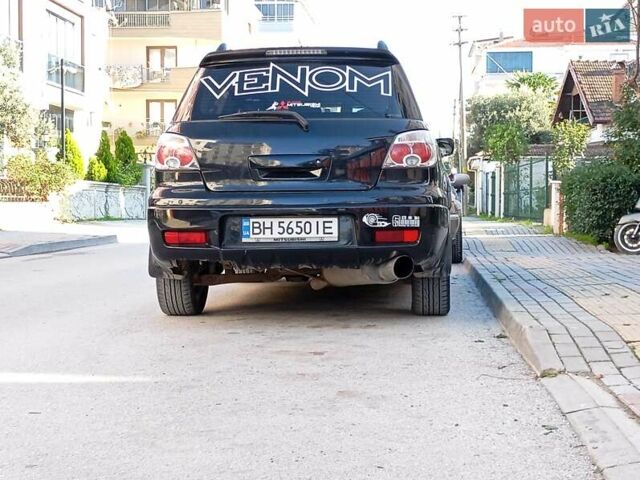 Черный Мицубиси Аутлендер, объемом двигателя 2 л и пробегом 216 тыс. км за 5600 $, фото 2 на Automoto.ua