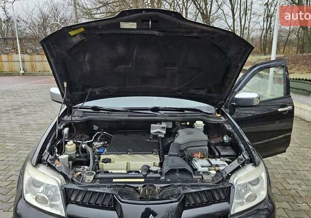 Черный Мицубиси Аутлендер, объемом двигателя 2.4 л и пробегом 167 тыс. км за 6150 $, фото 28 на Automoto.ua