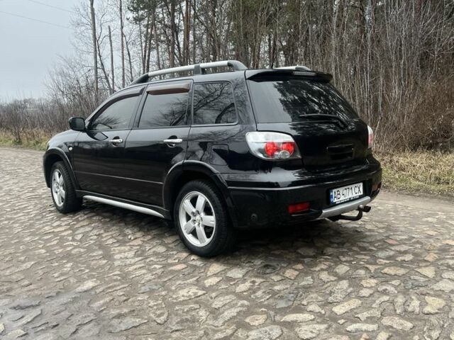 Черный Мицубиси Аутлендер, объемом двигателя 2.4 л и пробегом 310 тыс. км за 5300 $, фото 2 на Automoto.ua